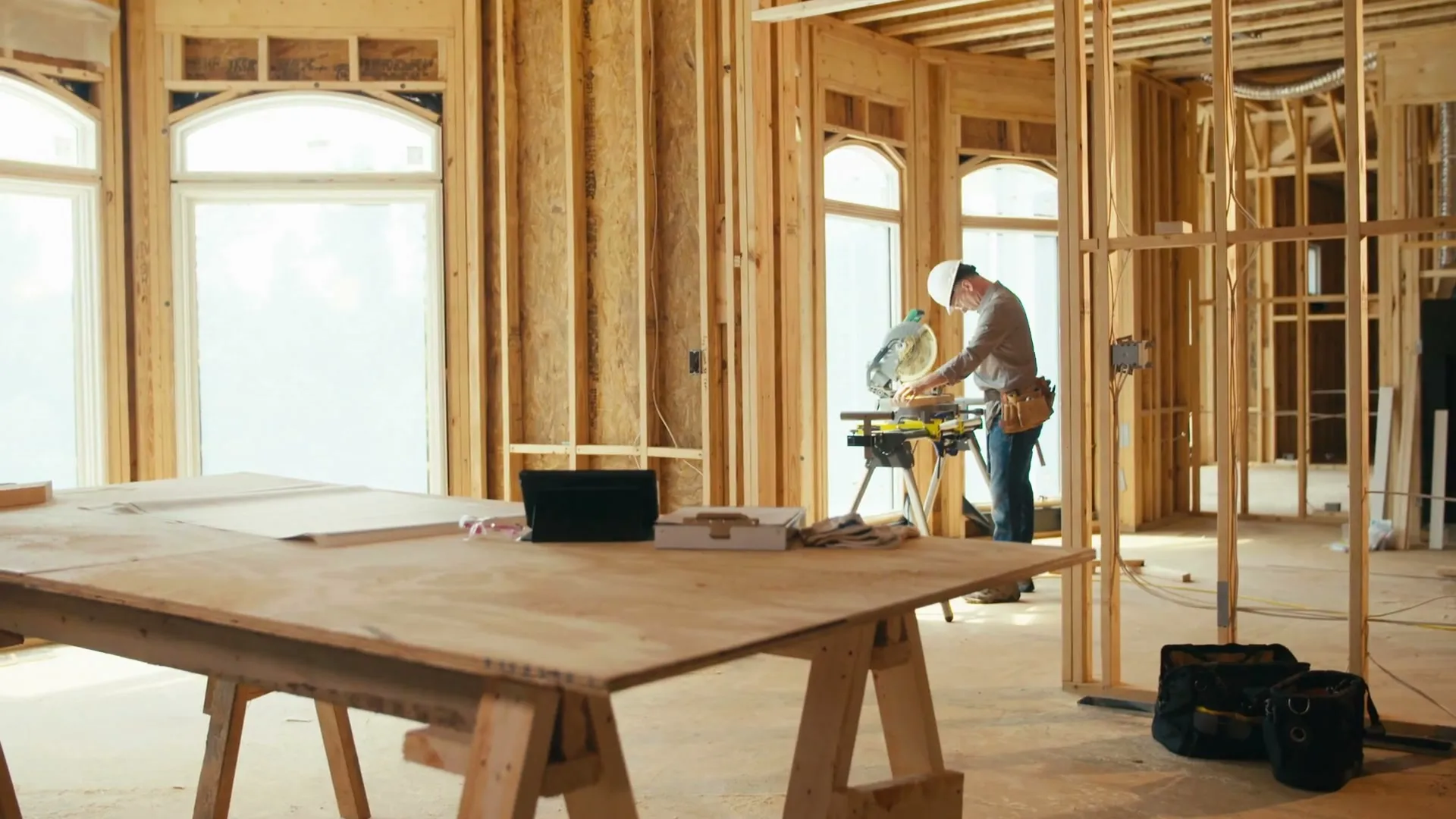 Interior wall framing with a crew at work