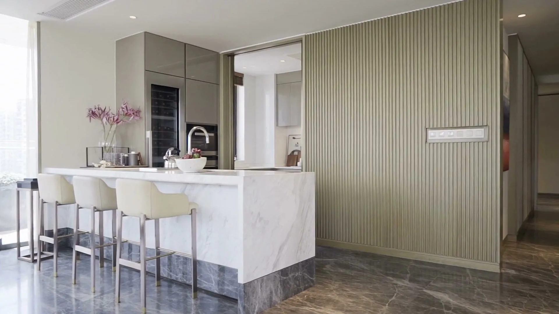 Kitchen with a marble island and bar seating